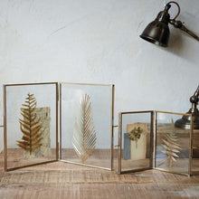 Load image into Gallery viewer, Our Danta antique black frame has a stunning finish that frames a photograph perfectly. The hand-forged metal framework and stand surrounds the elegant glass aperture.